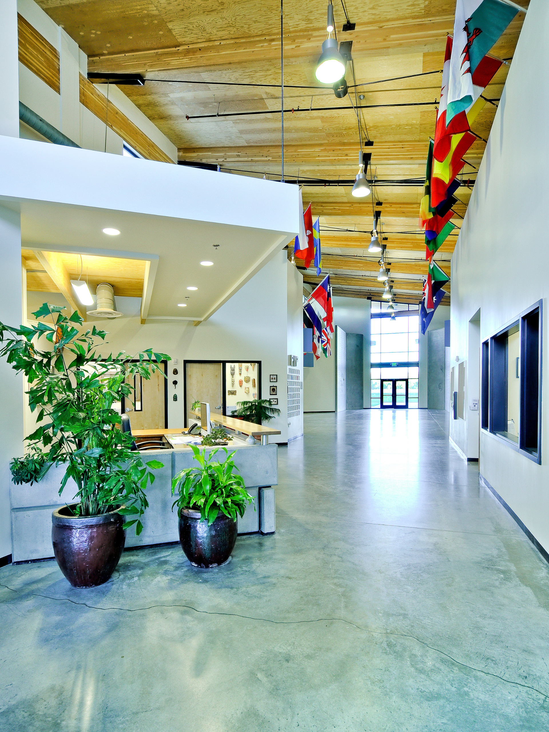 Riverstone Interior photo showcasing country flags and reception desk