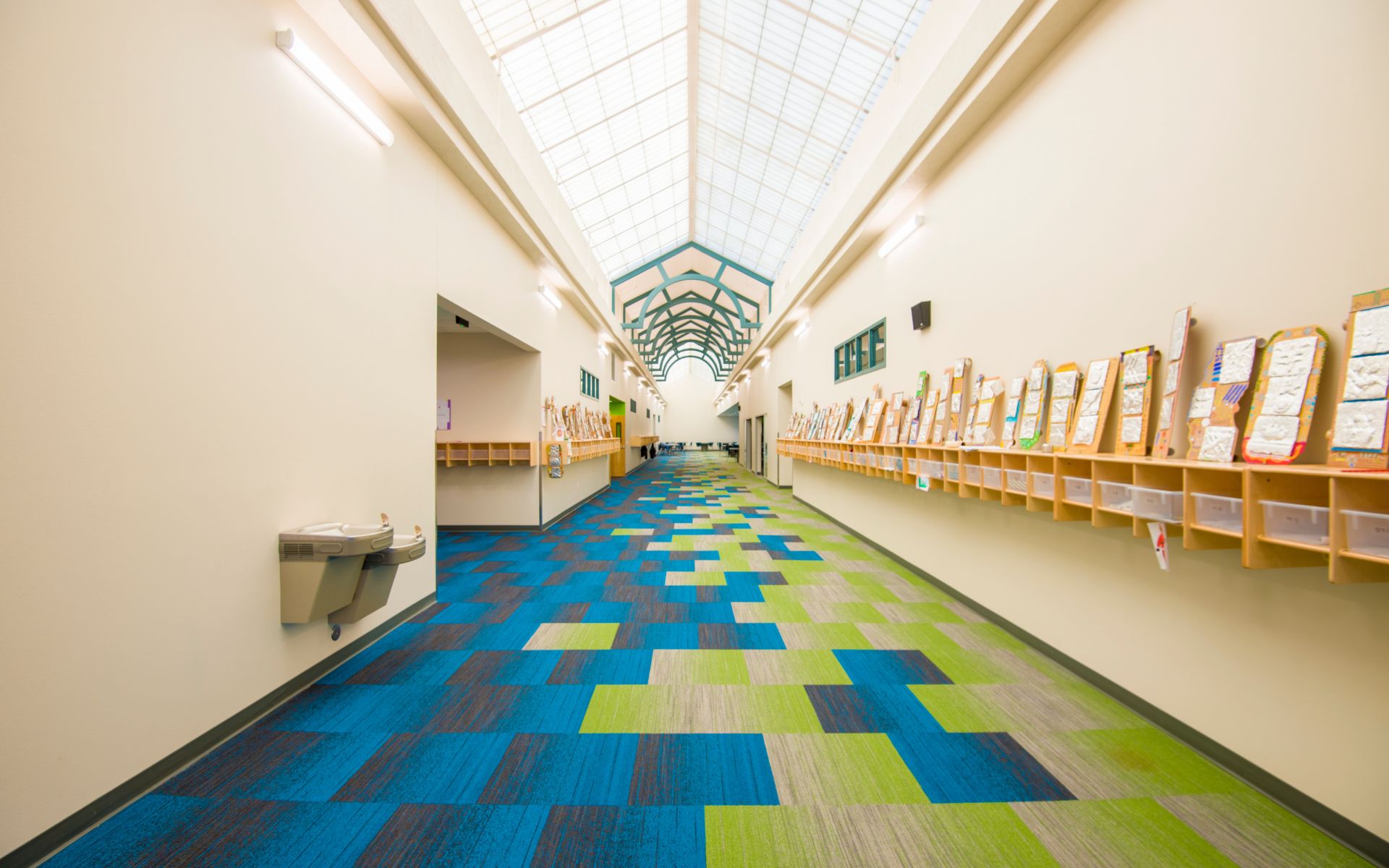Interior of Sage Boise with natural light and colorful flooring